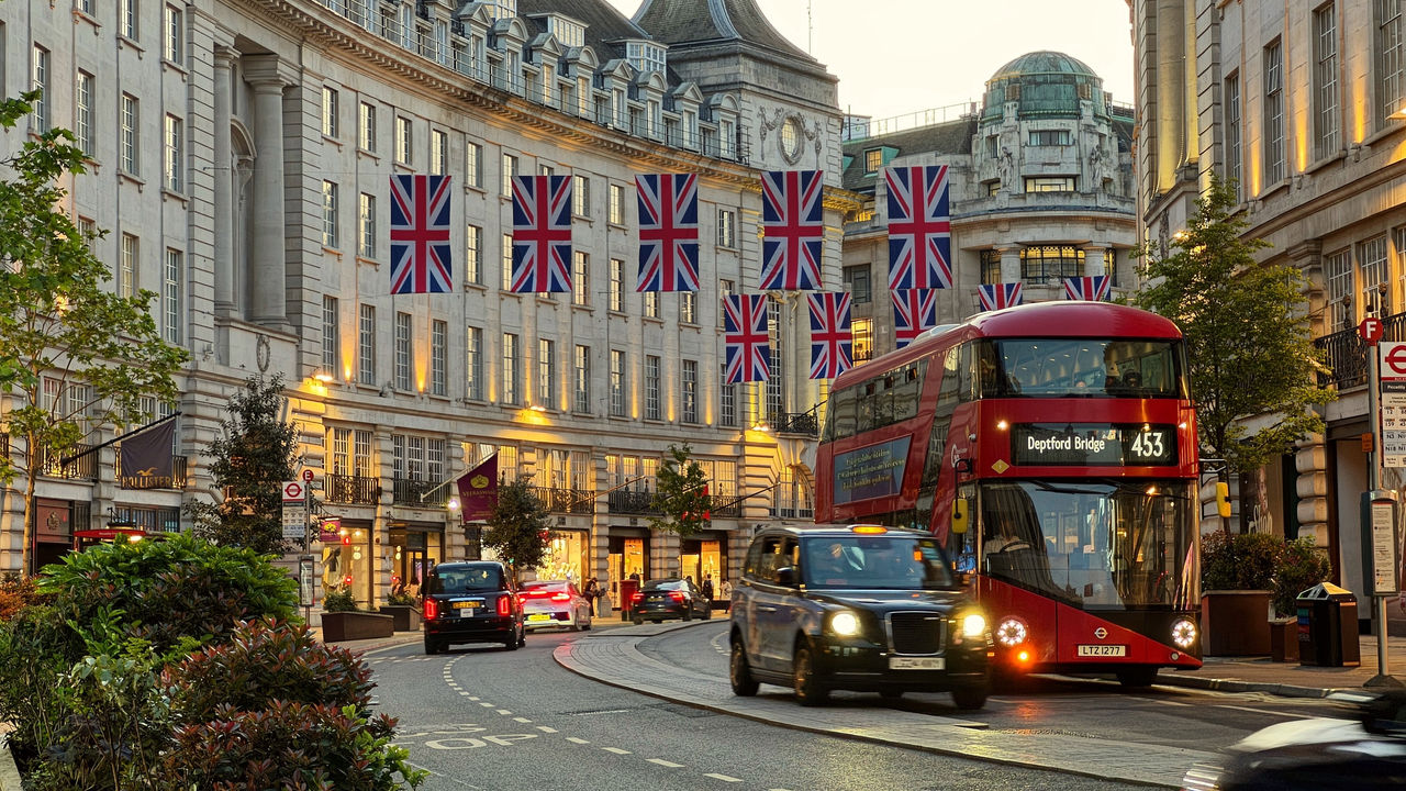 Black Cab and Red Bus captured on the busiest streets in London, at Regent Street on the 29th of April 2025.